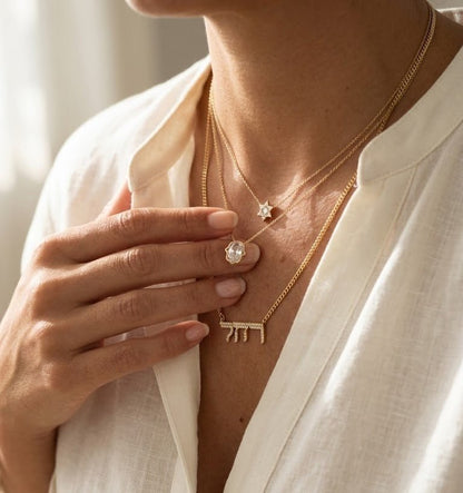 Hamsa Hand Pendant in 14k Yellow Gold, one lab grown diamond hand carved into the symbol of protection forever