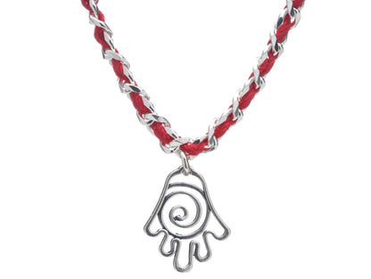 A stylish Hamsa infinity bracelet with a red string, featuring a unique sterling silver pendant symbolizing protection and good fortune.