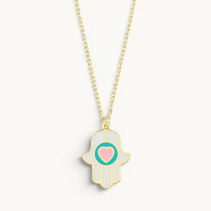 Heart hamsa necklace in white and pink enamel gold with dual protective symbols by Alef Bet