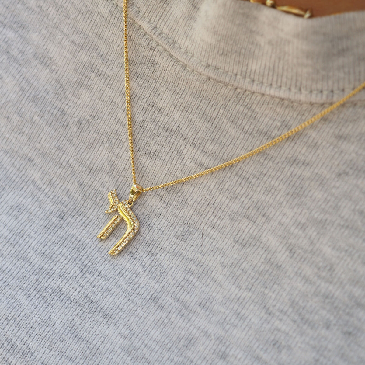 hebrew chai necklace in 14k gold