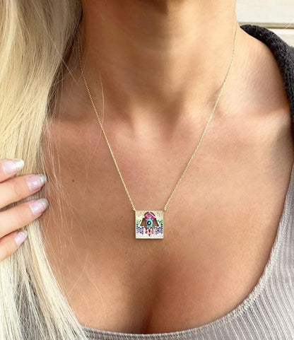 Intricate Gemstone Hamsa Pendant in Gold