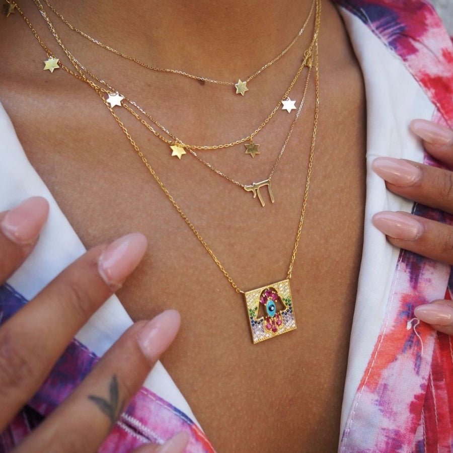 Intricate Gemstone Hamsa Pendant in Gold