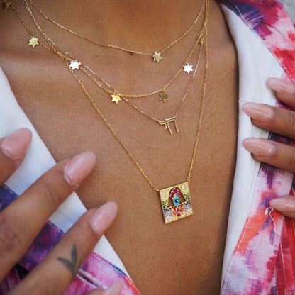 Intricate Gemstone Hamsa Pendant in Gold