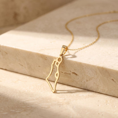 Gold Israel map pendant necklace showcasing engraved geographic borders by Alef Bet