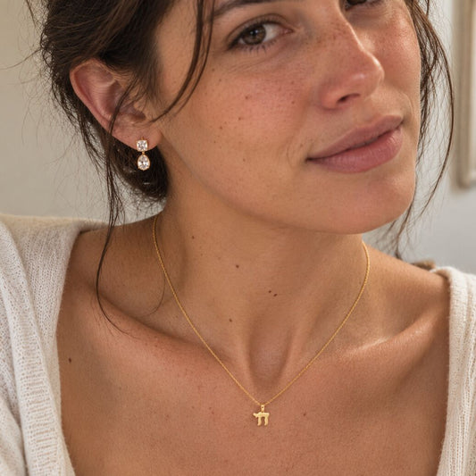 Mini chai necklace in 14k yellow gold with high-polish Hebrew symbol by Alef Bet
