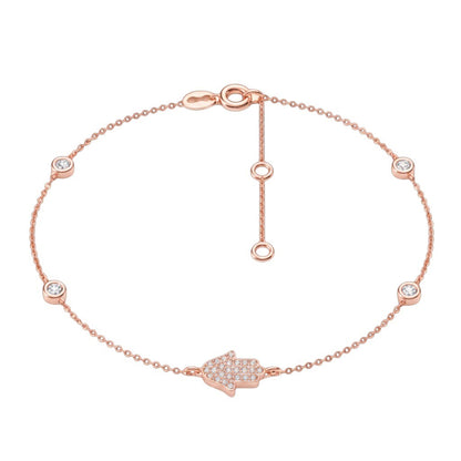 Hamsa bracelet in 14k gold featuring .12 ct diamonds and adjustable sizing, perfect for gifting on special occasions.