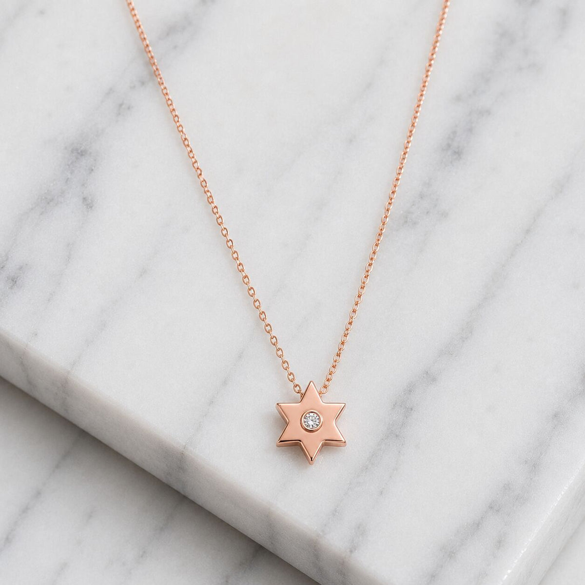 Delicate gold Star of David necklace with diamond center stone by Alef Bet