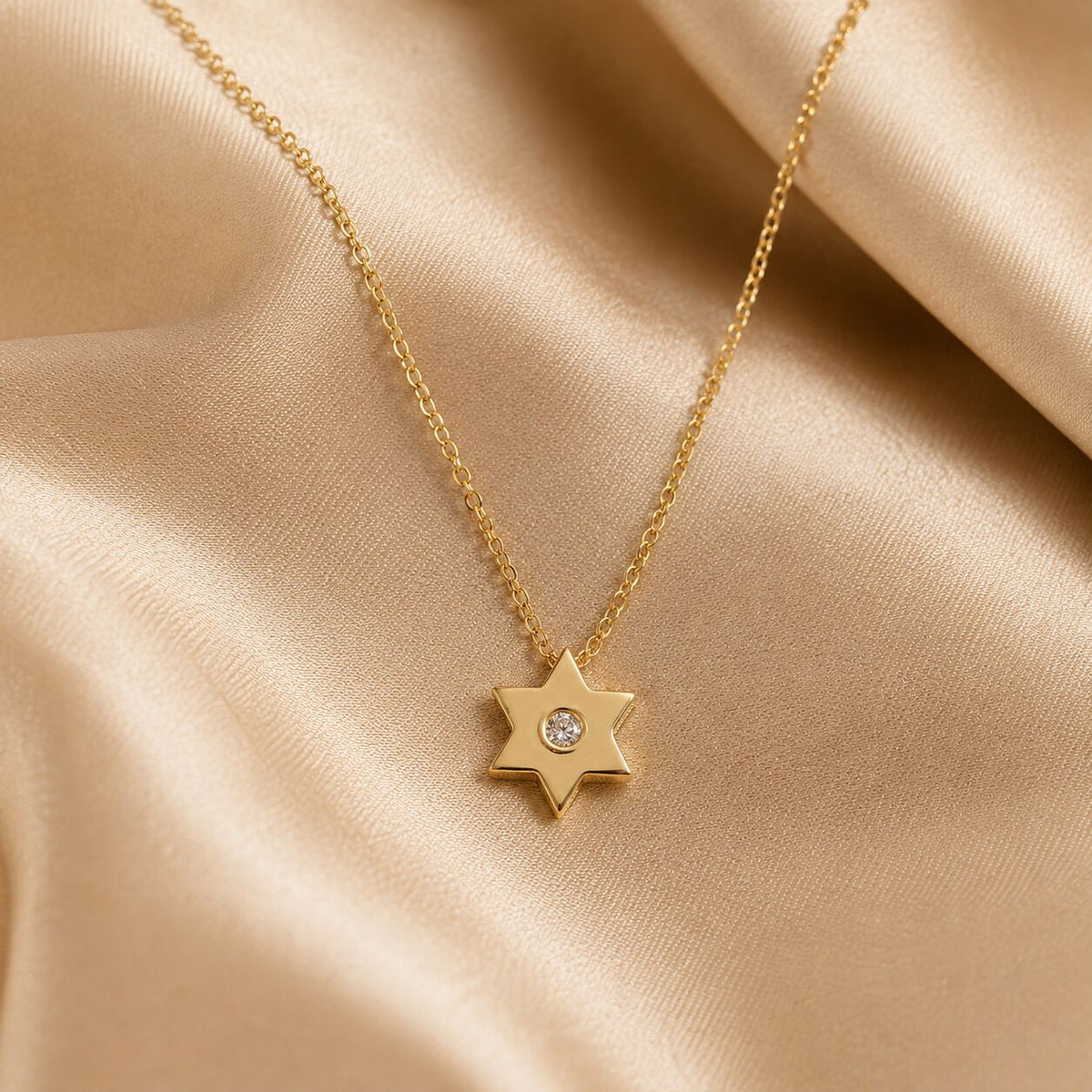 Simple gold Star of David pendant with pave diamond by Alef Bet