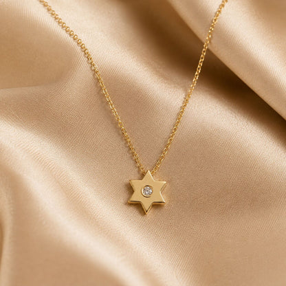Simple gold Star of David pendant with pave diamond by Alef Bet