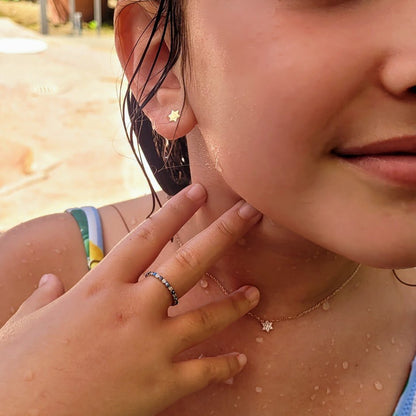Silver Jewish star earrings showcasing intricate six-point star by Alef Bet