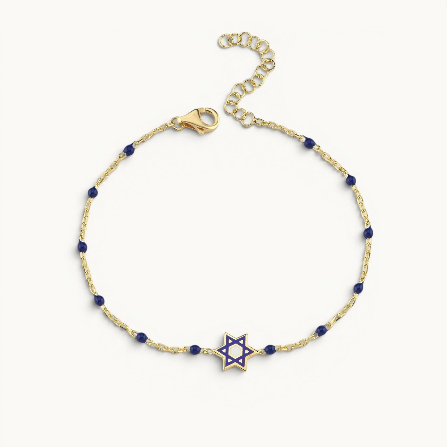 Sterling silver bracelet with yellow gold plating featuring enamel Jewish star bead by Alef Bet