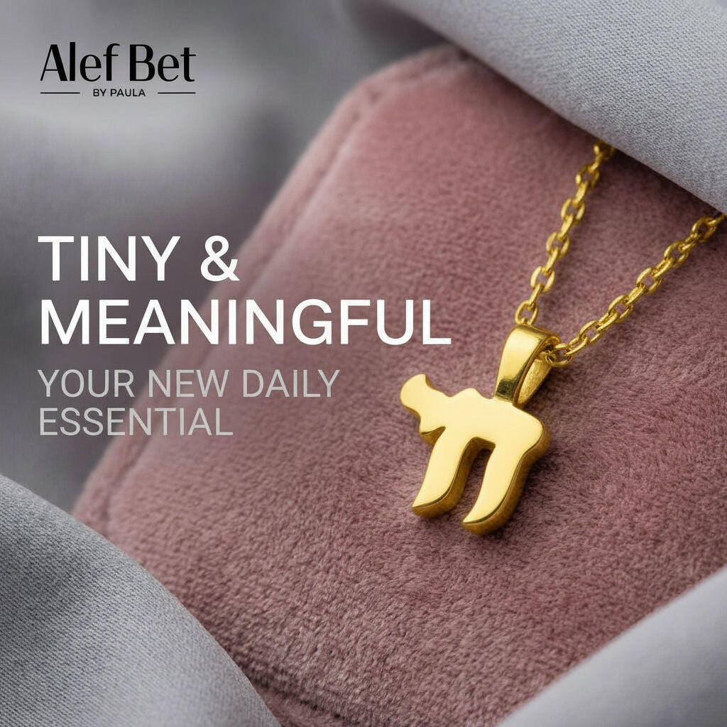 Mini chai pendant in polished silver with satin chain by Alef Bet