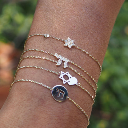 14k gold bracelet featuring magen david charm close-up on wrist by Alef Bet