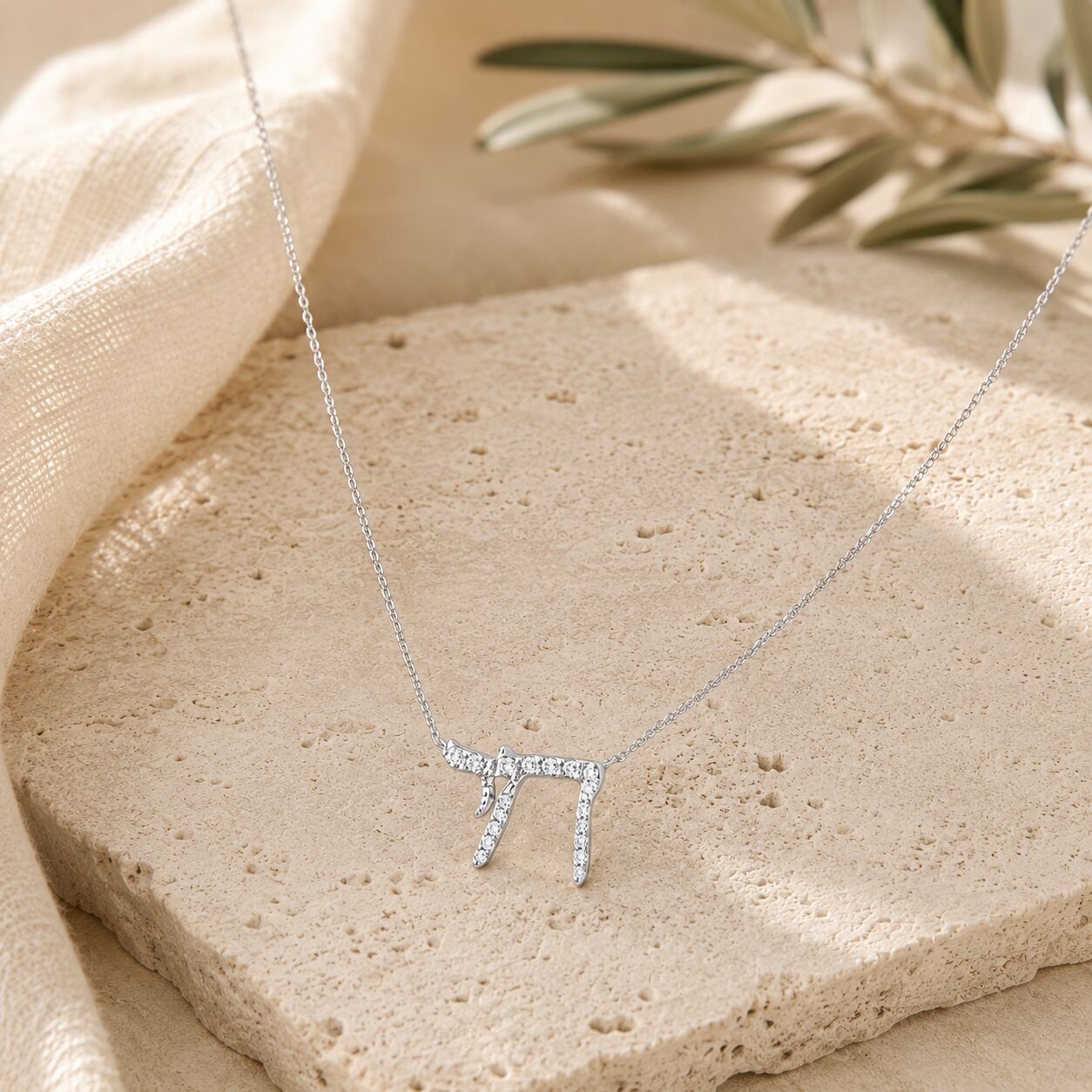 14k yellow gold chai pendant featuring diamond-set design by Alef Bet