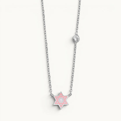 Star of David necklace in sterling silver with pink enamel and bezel-set cubic zirconia by Alef Bet