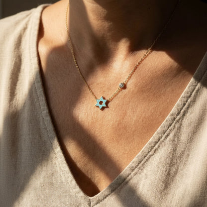Blue enamel Star of David pendant in yellow gold with bezel-set CZ by Alef Bet