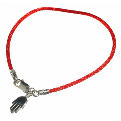 A sterling silver hamsa charm bracelet with a red string, symbolizing protection and good wishes, comes gift-wrapped with a meaning card.