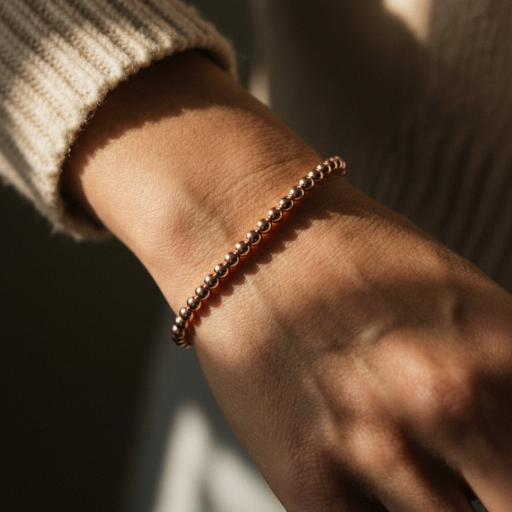 Rose gold beaded bracelet 4mm featuring polished round beads by Alef Bet
