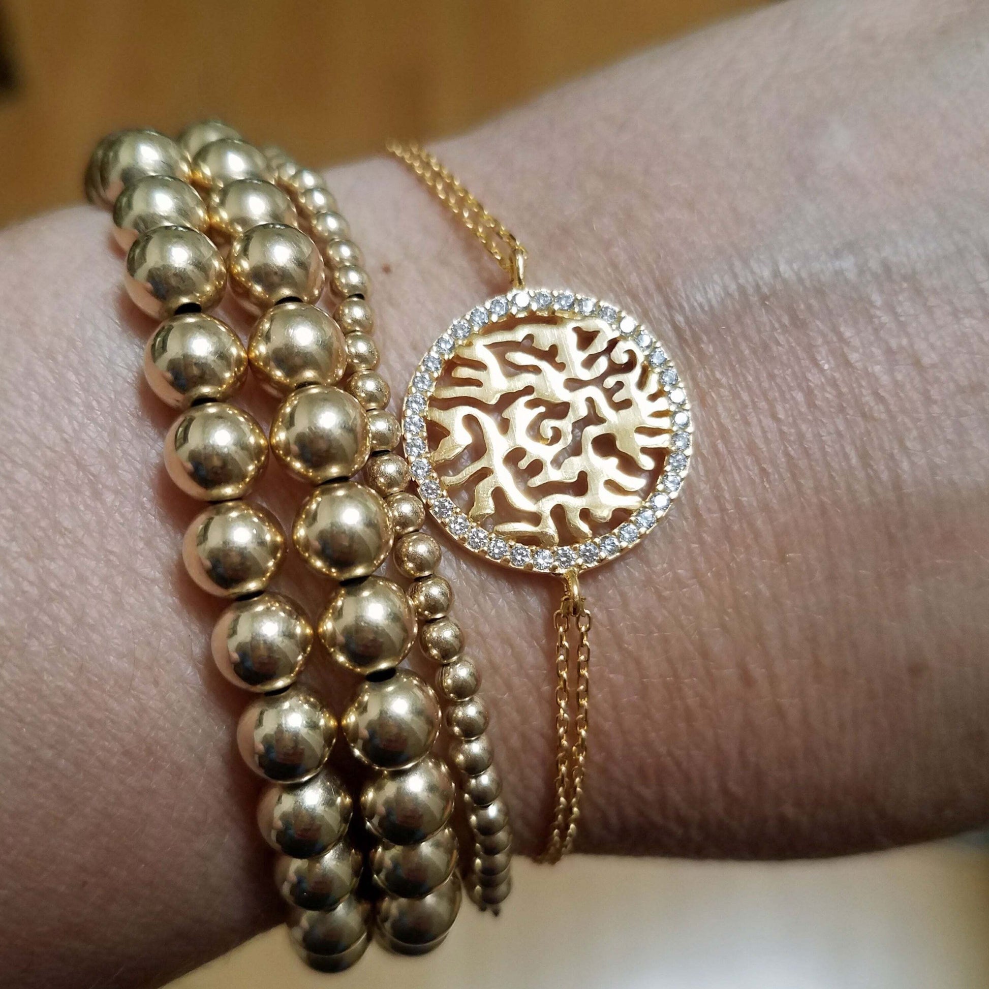 Sterling silver Shema Israel Hebrew prayer bracelet adorned with sparkling cubic zirconia, adjustable for perfect fit.