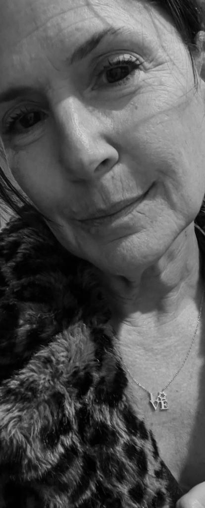 A sparkling sterling silver love letter necklace featuring L V E with a Star of David as the O, adjustable from 16" to 18".