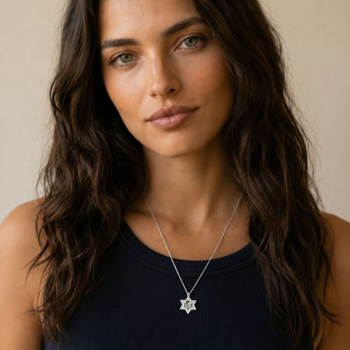 Sterling silver star pendant necklace with cutout love motif, front view by Alef Bet