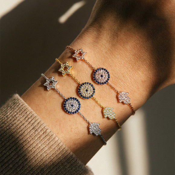 Yellow gold star hamsa evil eye bracelet featuring bezel-set cubic zirconia details by Alef Bet