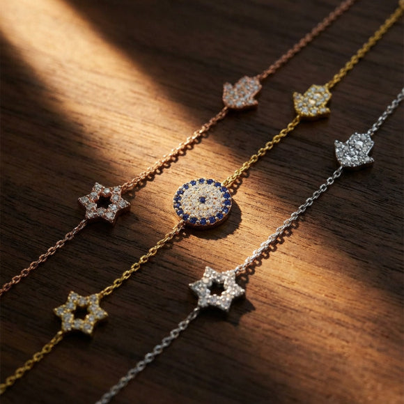 Evil eye hamsa star bracelet in yellow gold with pave cubic zirconia accents by Alef Bet