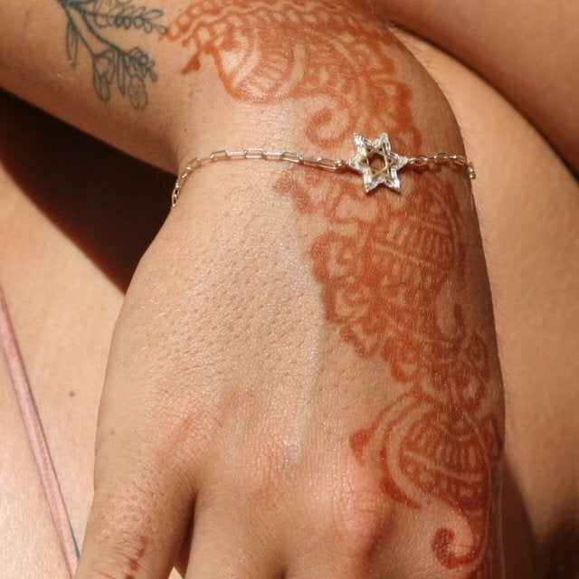 Silver or gold Star of David Baguette bracelet adorned with baguette cz gemstones, adjustable from 5.75" to 7" long.