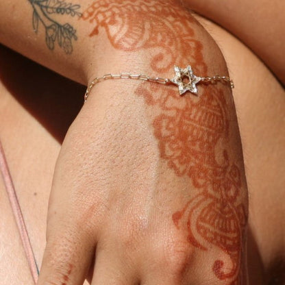Silver or gold Star of David Baguette bracelet adorned with baguette cz gemstones, adjustable from 5.75" to 7" long.