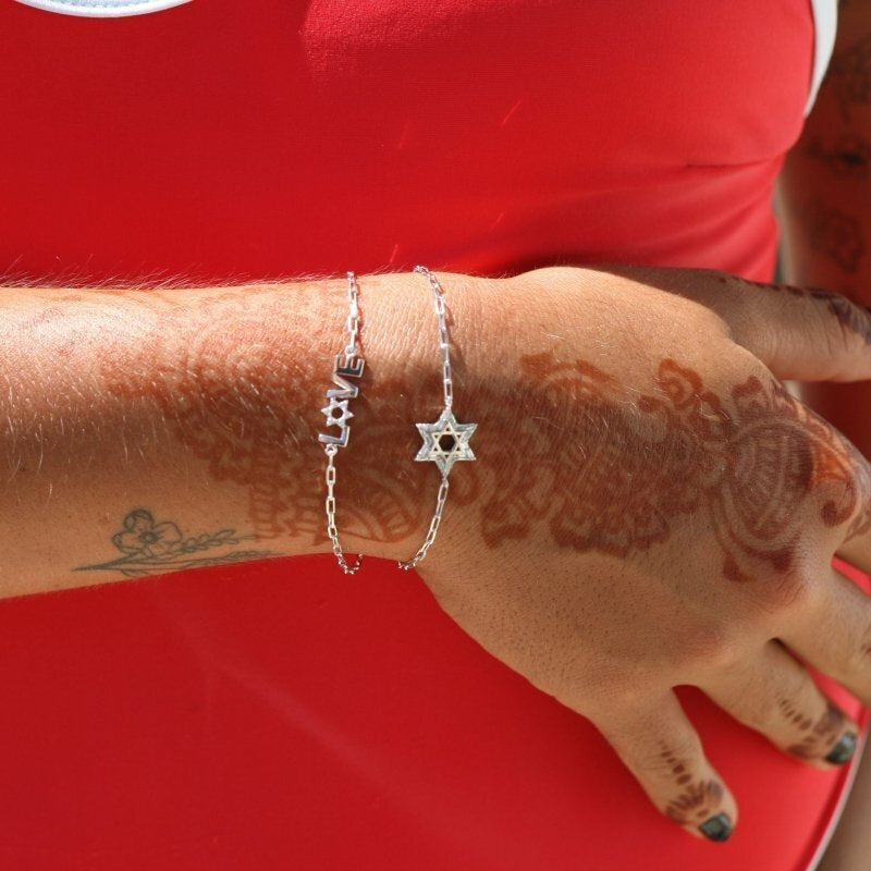 Stylish Star of David Baguette bracelet in silver or gold, featuring baguette cz gems and adjustable sizing. A modern faith expression.