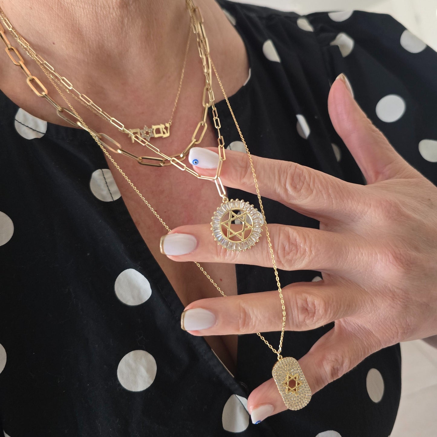 Star of David medallion in yellow gold with layered geometric design by Alef Bet