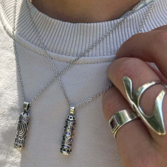 Star of David mezuzah pendant necklace showcasing intricate geometric detailing by Alef Bet