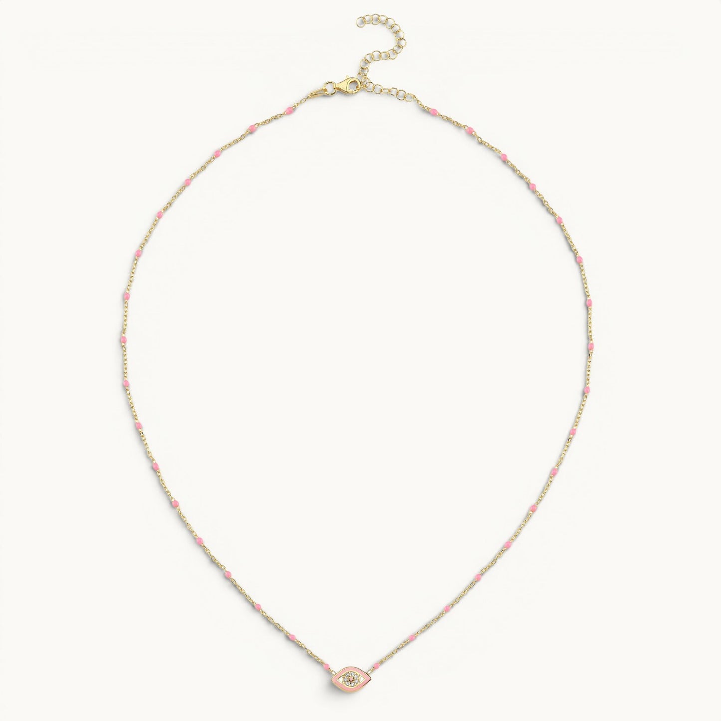 Small evil eye necklace in yellow gold with pink enamel by Alef Bet