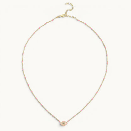 Small evil eye necklace in yellow gold with pink enamel by Alef Bet