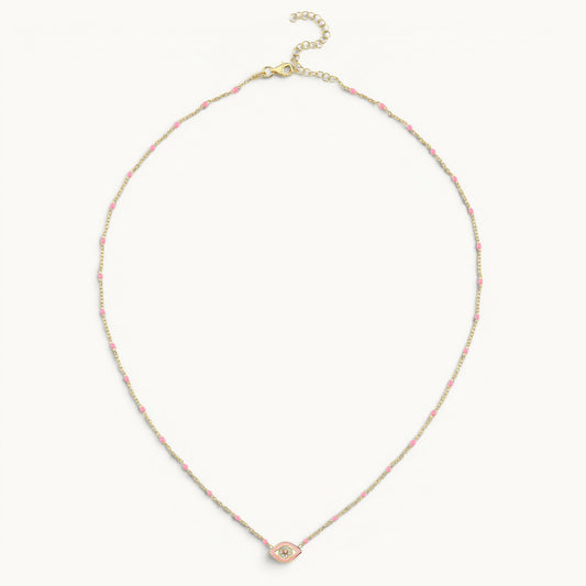 Small evil eye necklace in yellow gold with pink enamel by Alef Bet