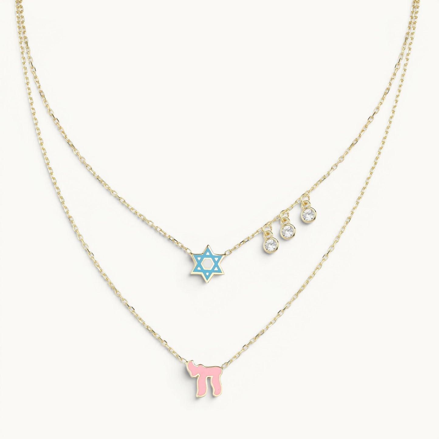 Layered necklace in blue and pink with pave-set gem accents by Alef Bet