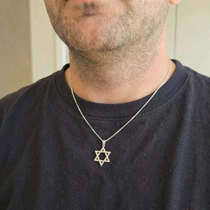 Sterling silver Star of David necklace on a box chain, 3/4"x3/8". Unisex design, timeless symbol of heritage and identity.