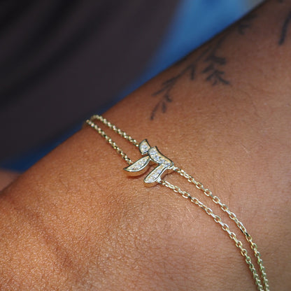 14k gold chai bracelet featuring dual chains with pave diamond accents by Alef Bet