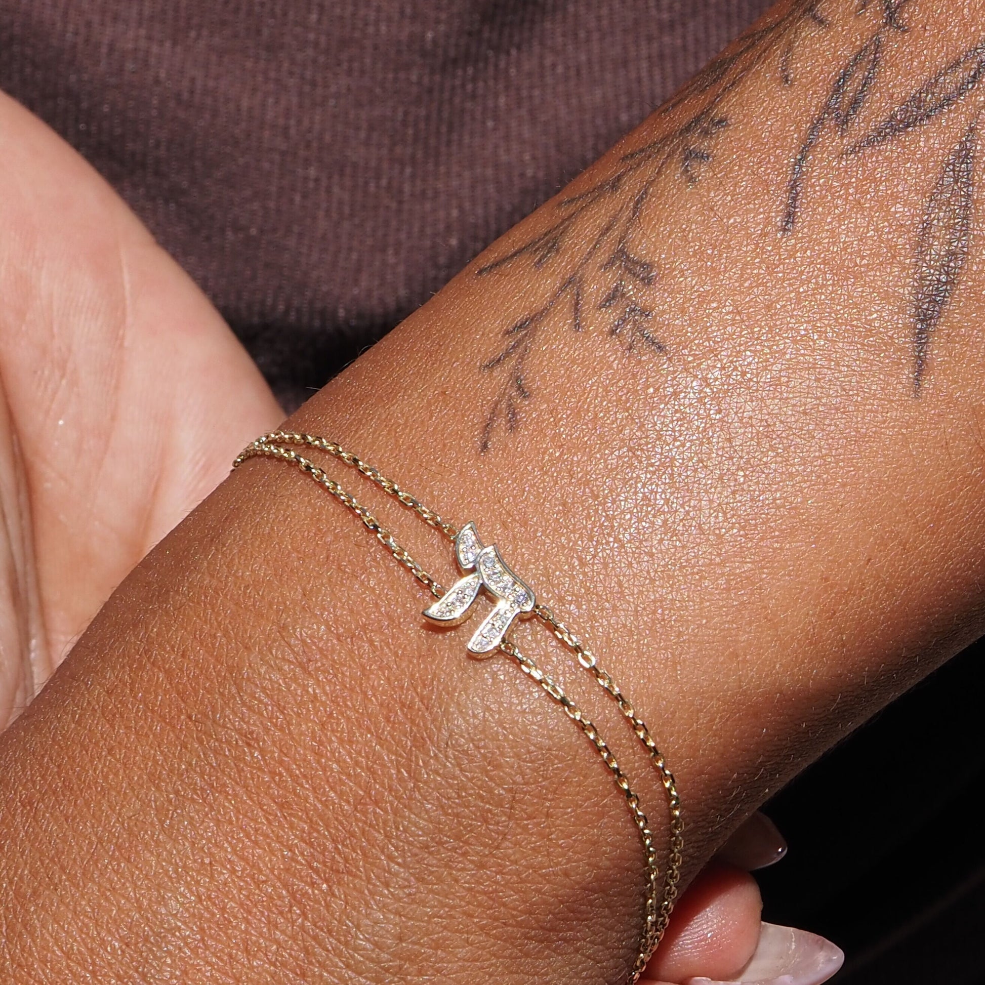 Pave diamond chai bracelet in 14k gold with intertwined double chain detail by Alef Bet