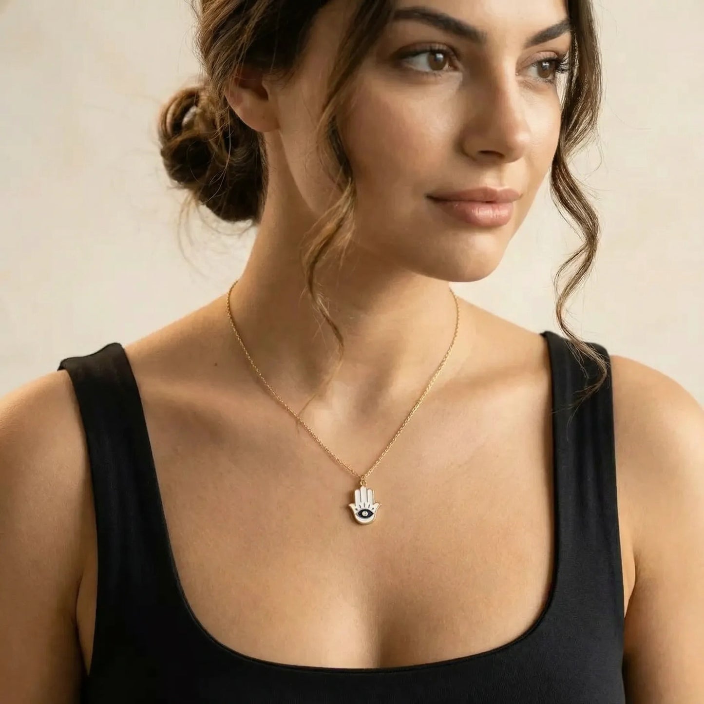 Statement hamsa necklace with pave-style evil eye in navy and pink enamel by Alef Bet