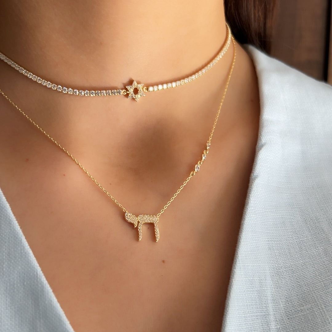 L'Chaim Sparkle necklace yellow gold pendant close-up with high-polish finish by Alef Bet