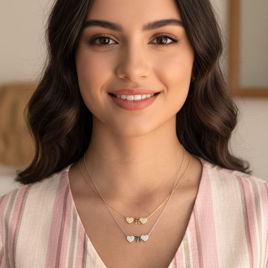 Silver necklace with two hearts and a Chai symbol, adorned with sparkling CZ gems, featuring an adjustable 16" to 18" chain.