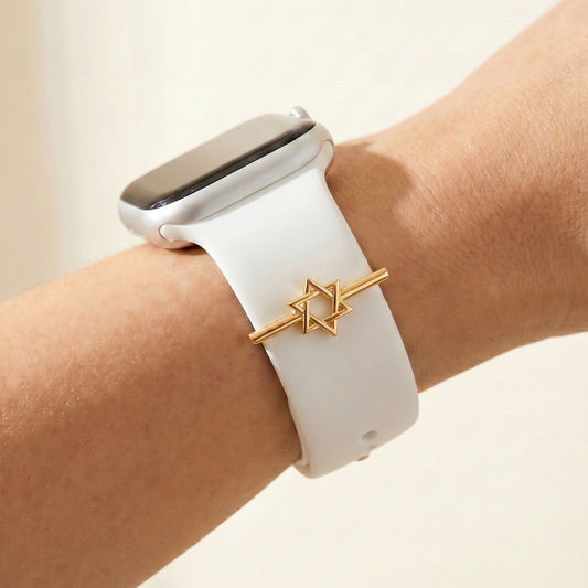 Smartwatch with a white band and Jewish star on a wrist against a beige background