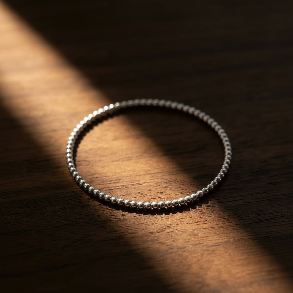 Minimalist silver bead bracelet featuring 2mm high-polish round beads by Alef Bet