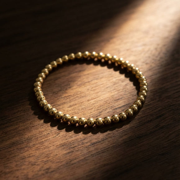 Yellow gold beaded bracelet 4mm displaying gleaming spherical beads by Alef Bet