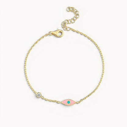 Evil eye bracelet in yellow gold plated with pink turquoise enamel by Alef Bet