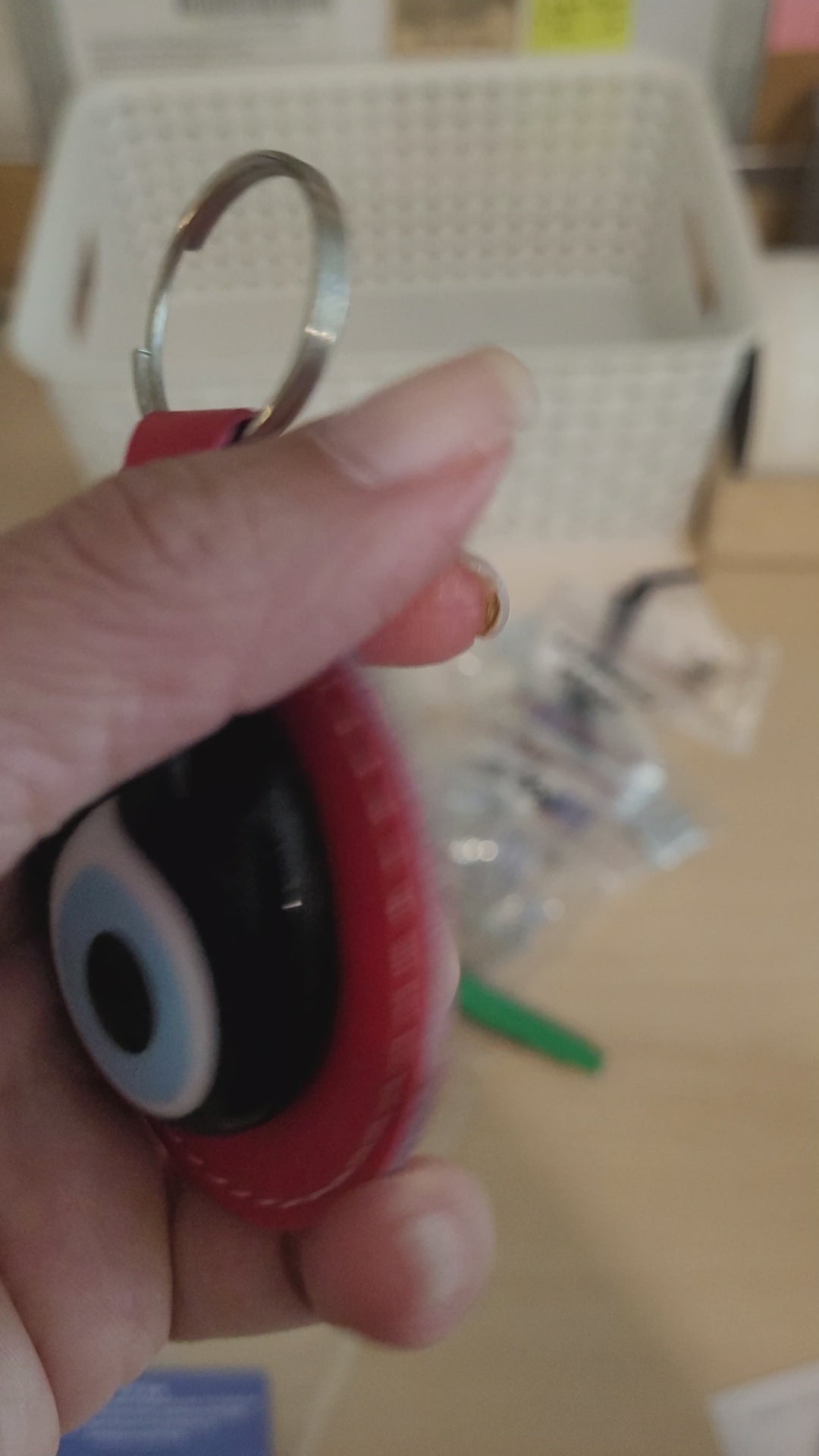 see a keyring with red evil eye