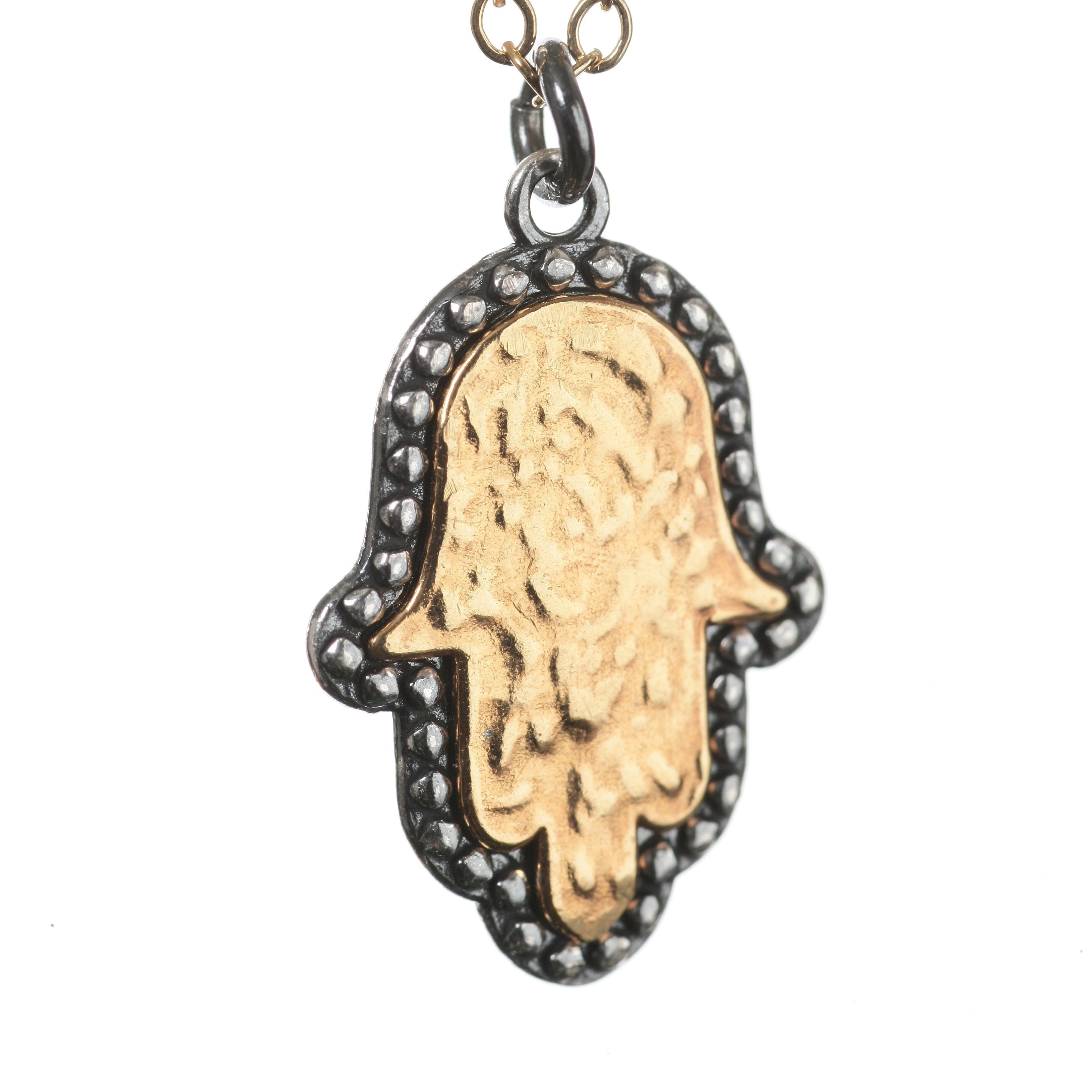 hamsa hand in gold and silver