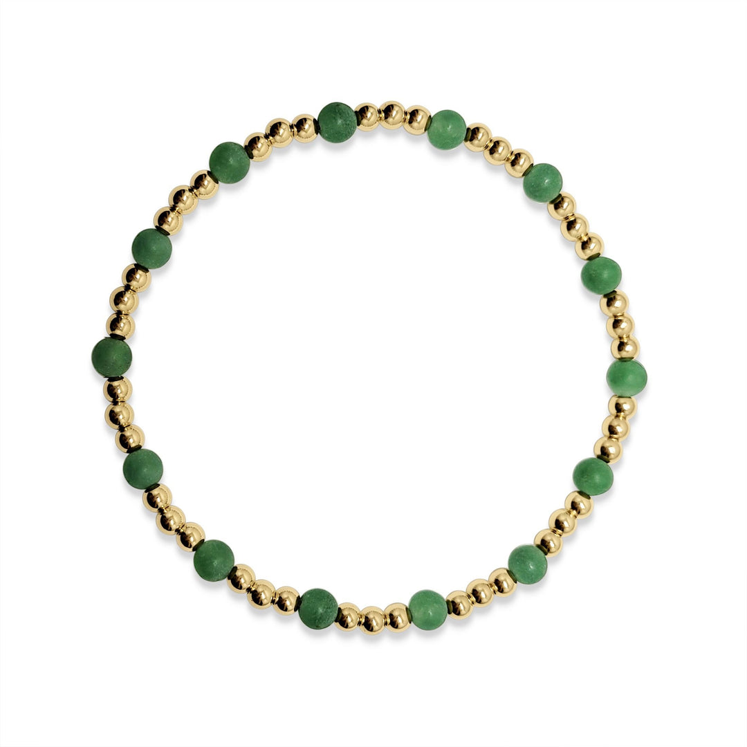 green bead bracelet and gold