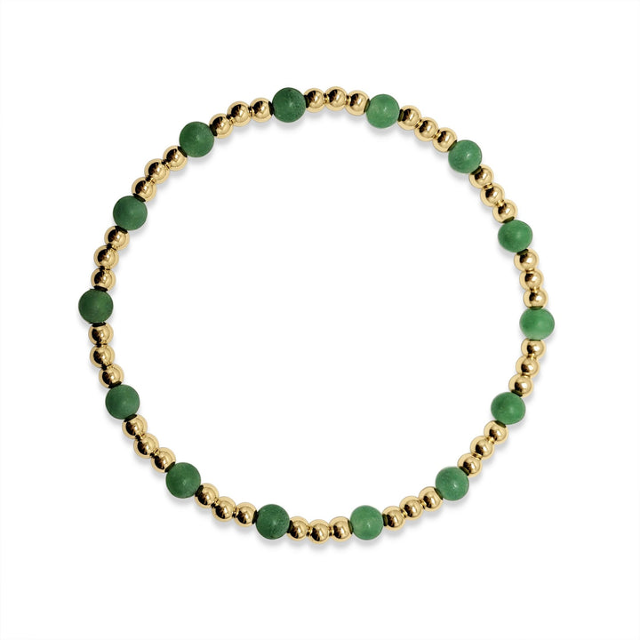 green bead bracelet and gold